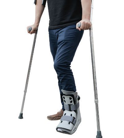 What types of injuries require walking boots?